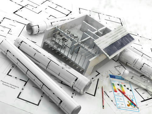 Consultant reviewing building plans and energy compliance documents
